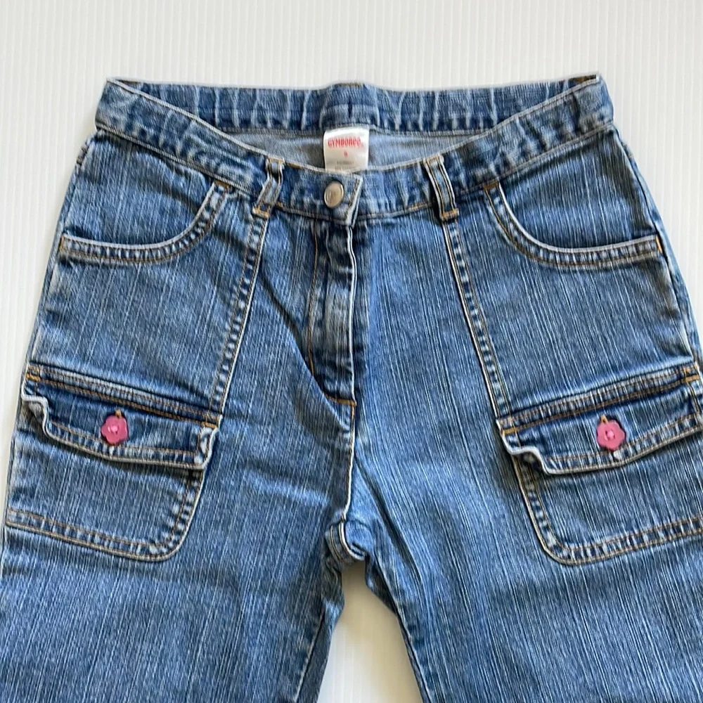 Flared Gymboree jeans with rainbow stitching & beading. Girls size 9